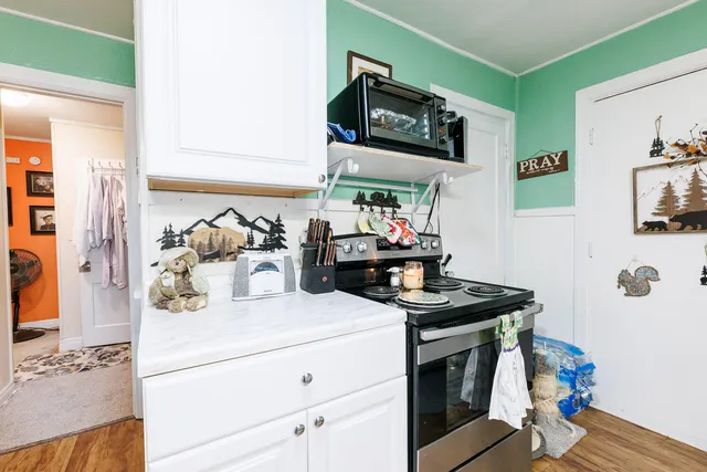 a kitchen with a stove and a microwave