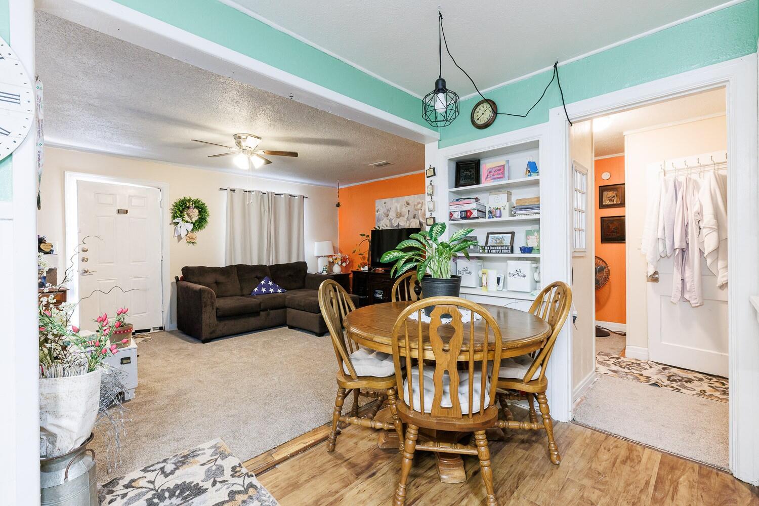 2004 26th Street Lubbock, TX 79411 - Photo 12 of 16 a view of a dining room with furniture window and wooden floor