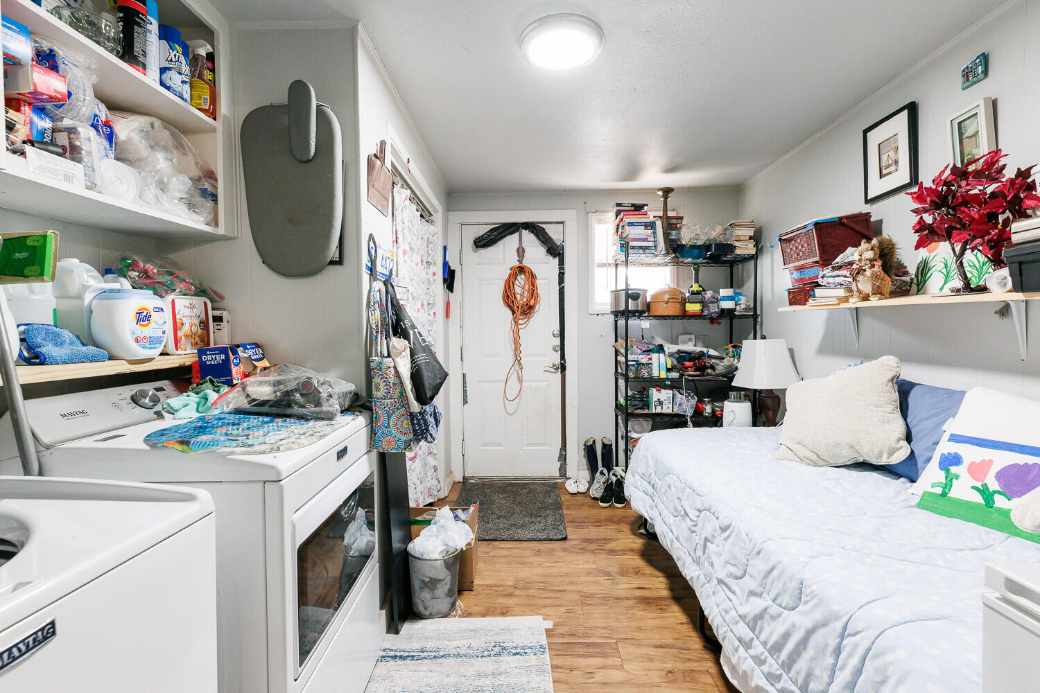 2004 26th Street Lubbock, TX 79411 - Photo 16 of 16 a bed room with a bed and a couch