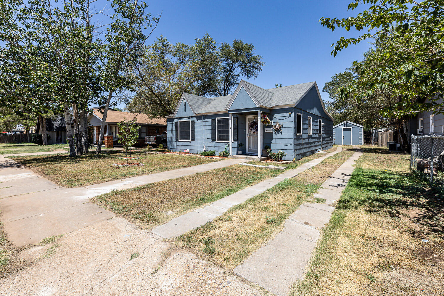 2004 26th Street Lubbock, TX 79411 - Photo 2 of 16 a front view of a house with a yard