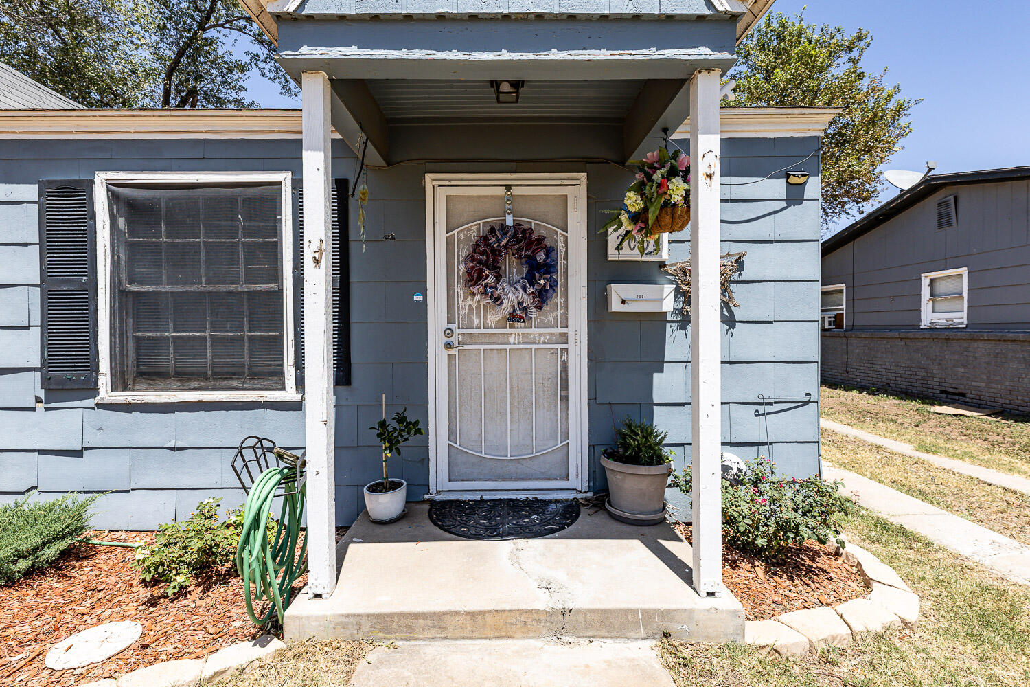 2004 26th Street Lubbock, TX 79411 - Photo 4 of 16 a front view of a house with a yard