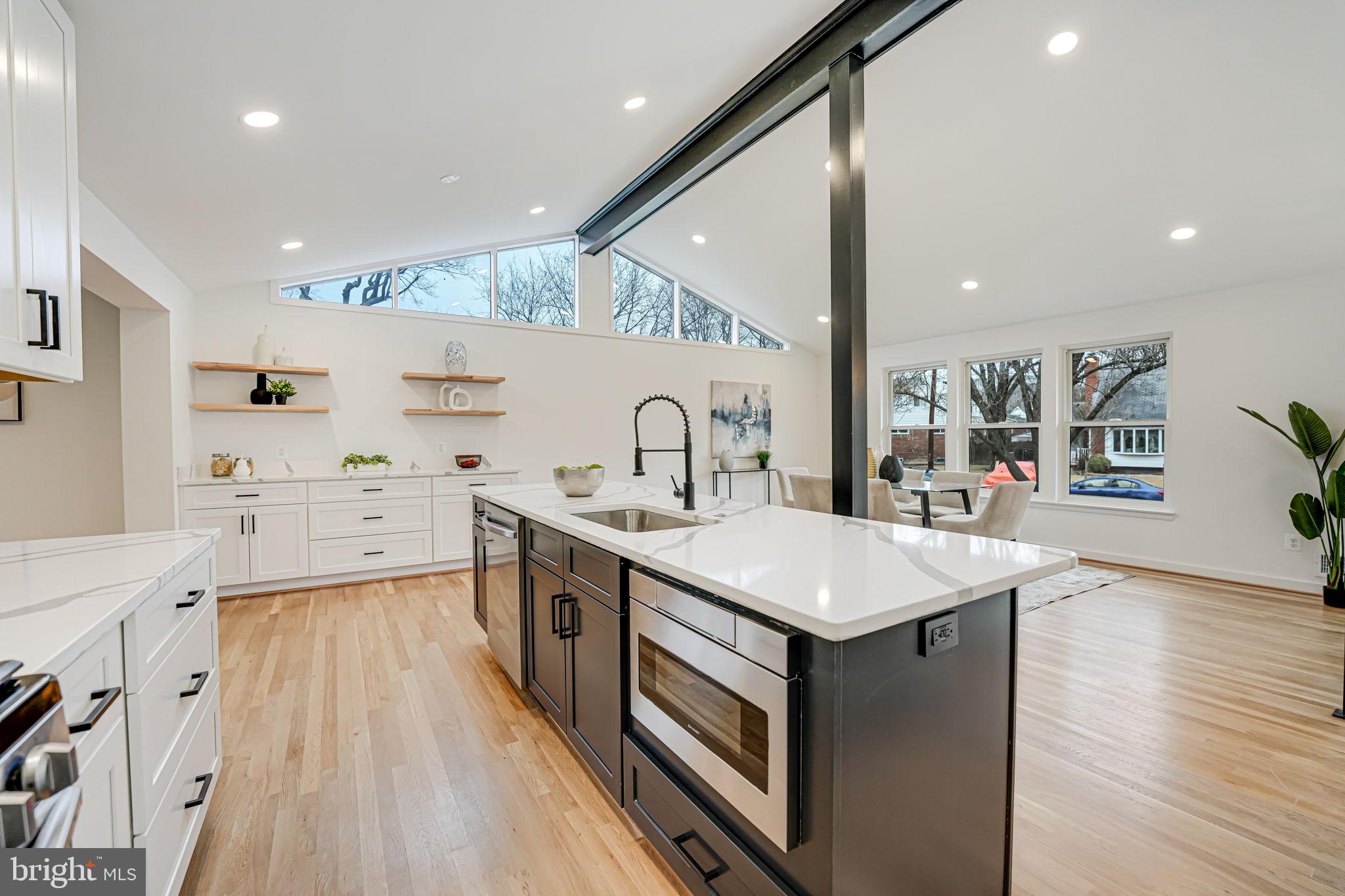 5108 Sutton Place Alexandria, VA 22304 - Photo 12 of 53 a kitchen with a sink stove and wooden floor