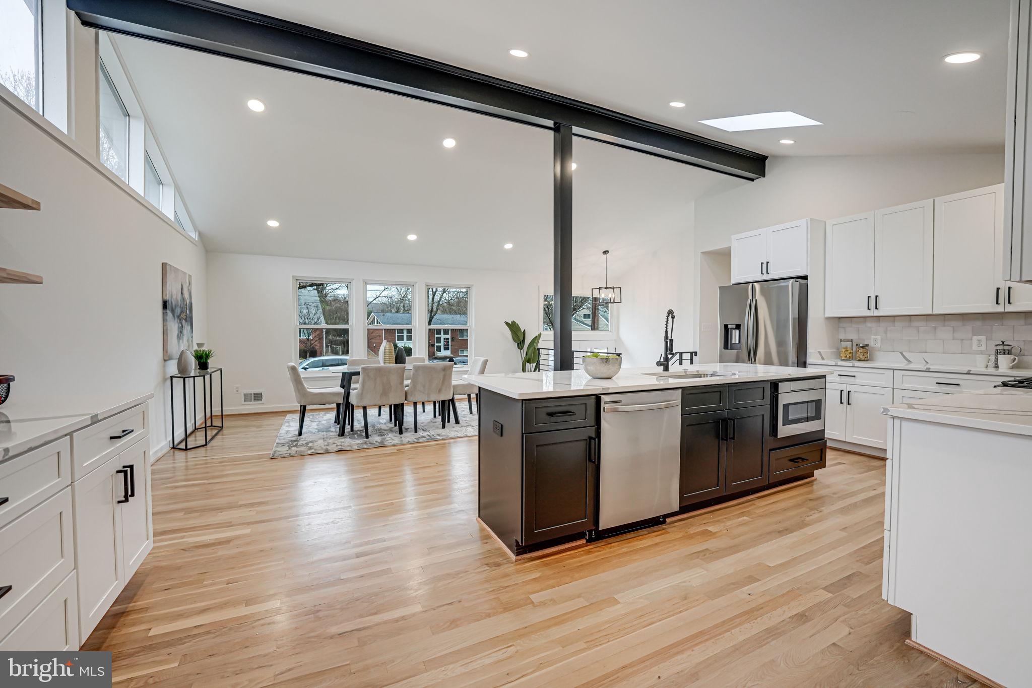 5108 Sutton Place Alexandria, VA 22304 - Photo 15 of 53 a large kitchen with stainless steel appliances granite countertop a large center island and a wooden floors