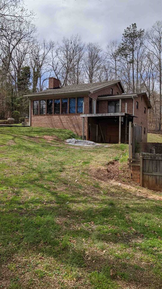 8468 East Union Hill Road Winston, GA 30187 - Photo 1 of 1 a front view of a house with a garden