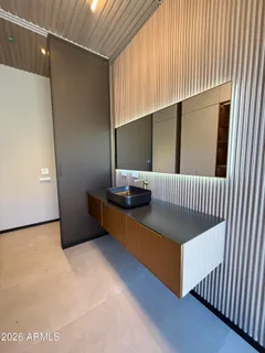 a view of kitchen appliances and cabinets