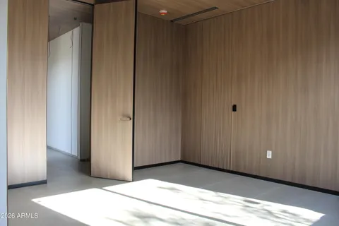 an empty room with wooden floor