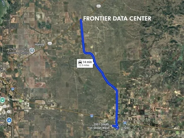 a street sign that is on a brick wall