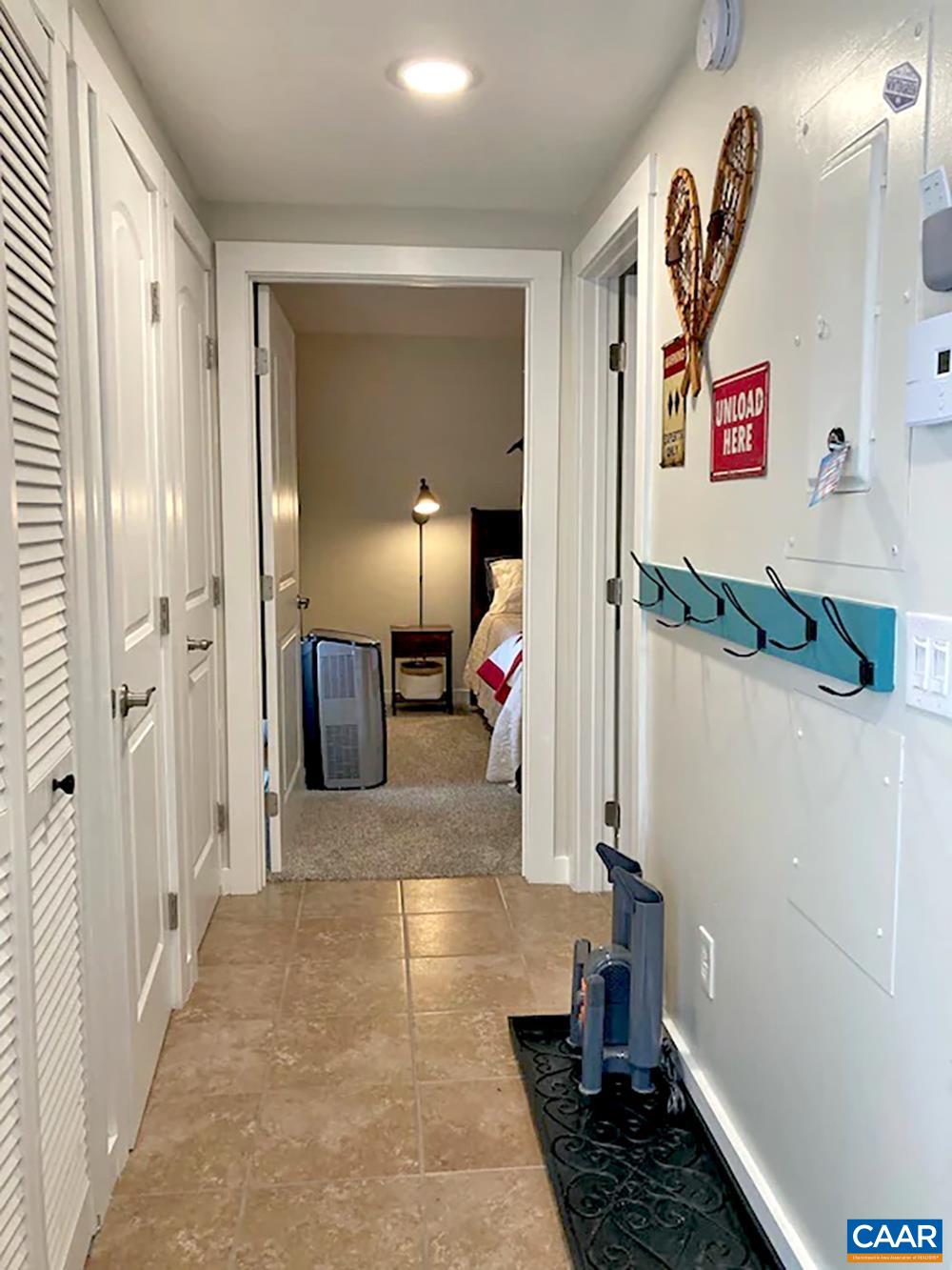2240 Tanners Ridge Roseland, VA 22967 - Photo 18 of 30 a view of a hallway to a livingroom with wooden floor and furniture