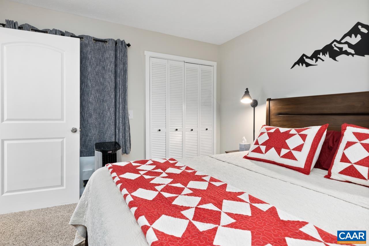 2240 Tanners Ridge Roseland, VA 22967 - Photo 21 of 30 a bedroom with a bed and a painting on the wall
