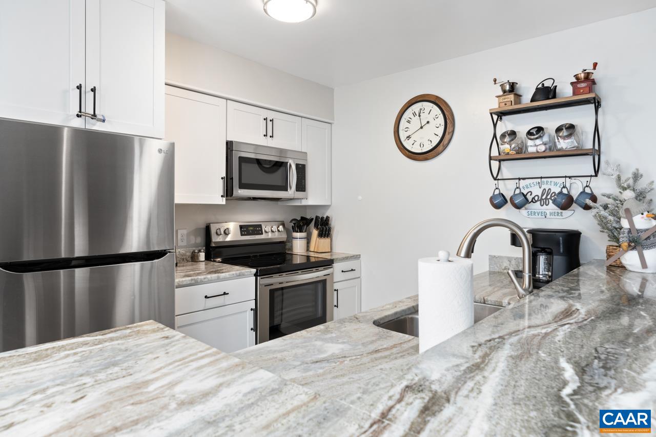 2240 Tanners Ridge Roseland, VA 22967 - Photo 8 of 30 a kitchen with stainless steel appliances granite countertop a refrigerator a stove a sink and a microwave