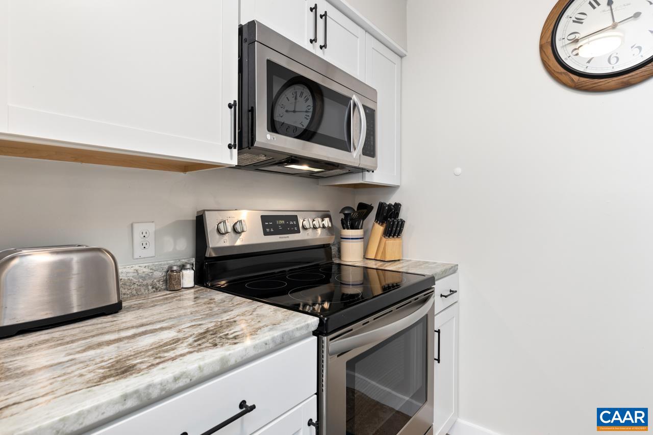 2240 Tanners Ridge Roseland, VA 22967 - Photo 10 of 30 a kitchen with stainless steel appliances granite countertop a stove and a microwave