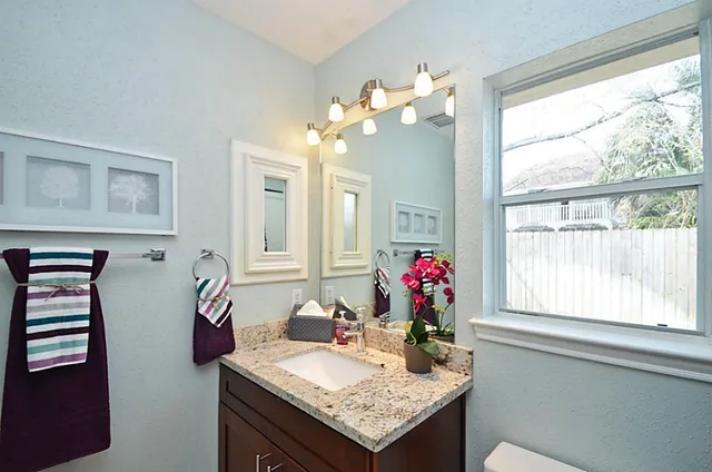 a view of a dining room with furniture and a chandelier