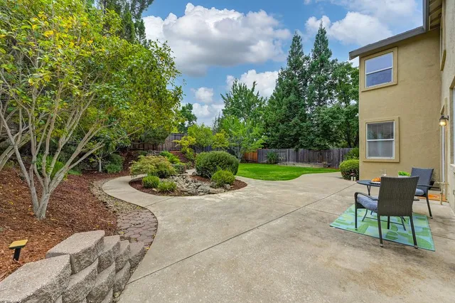 a view of a house with a yard porch and sitting area
