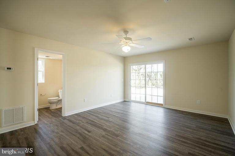 208 Bend Farm Road Fredericksburg, VA 22408 - Photo 7 of 16 a view of an empty room with a window and wooden floor
