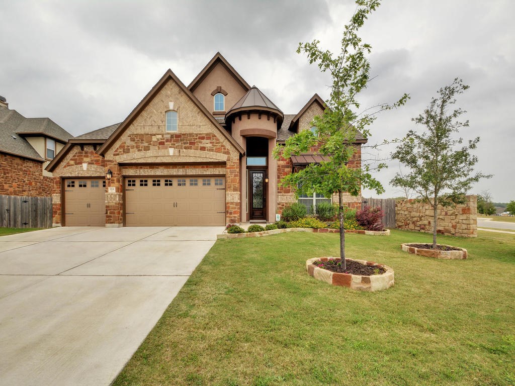 a front view of a house with a yard