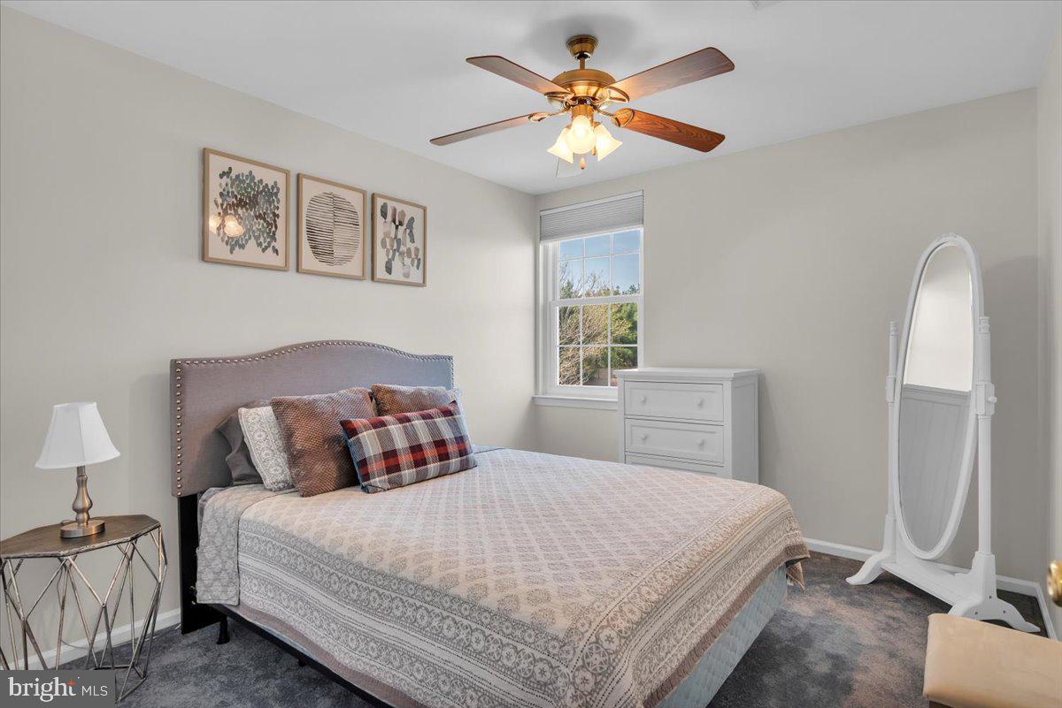 6 Rainbow Drive Sewell, NJ 08080 - Photo 17 of 29 a bedroom with a bed and a chandelier