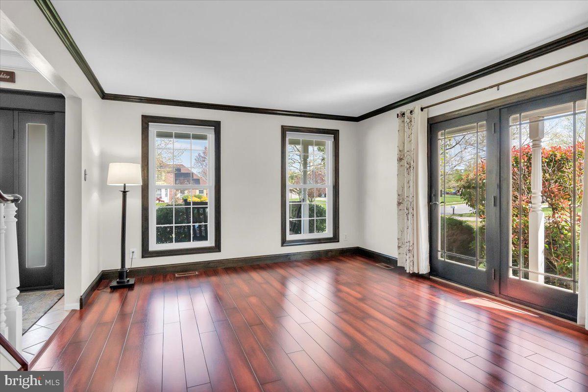 6 Rainbow Drive Sewell, NJ 08080 - Photo 3 of 29 an empty room with wooden floor and windows
