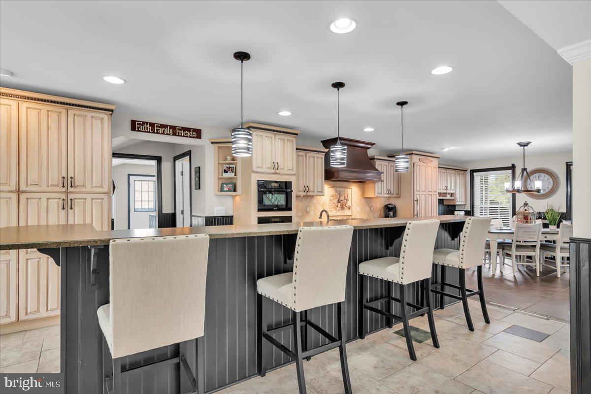 6 Rainbow Drive Sewell, NJ 08080 - Photo 6 of 29 a dining room with stainless steel appliances kitchen island a table chairs and a kitchen view