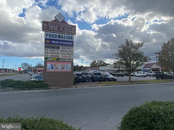 a sign board on the side of a street
