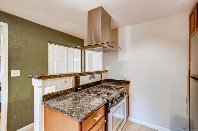 a utility room with a sink and cabinets