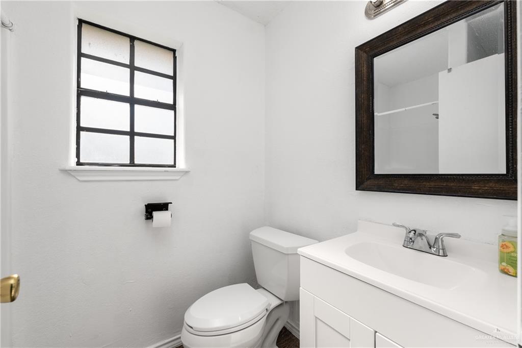20538 Rio Rancho Road Harlingen, TX 78552 - Photo 7 of 19 Bathroom with vanity and toilet