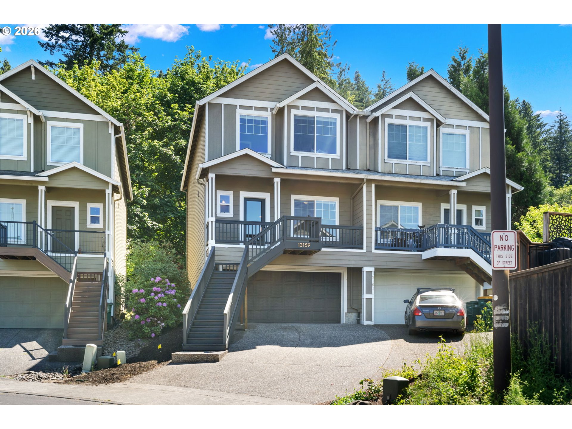 13159 Southwest Brianne Way Portland, OR 97223 - Photo 1 of 32 a front view of a house with a yard and balcony