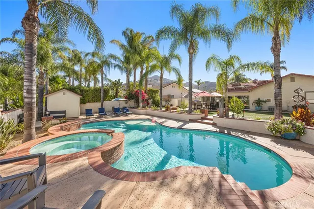 a view of a swimming pool with a lounge chairs