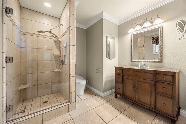 a large white kitchen with a large window and kitchen view