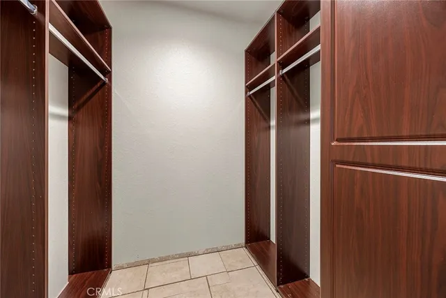 a bedroom with bed and window