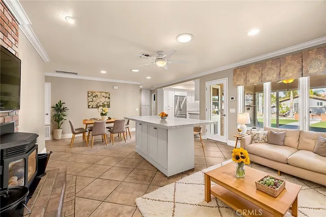 a large white kitchen with a large window