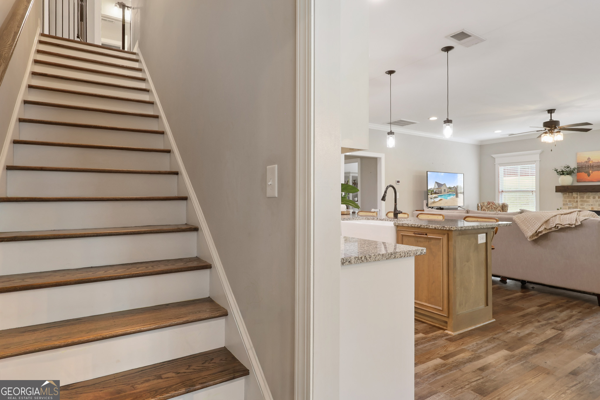 89 Claire Road Forsyth, GA 31029 - Photo 26 of 40 a view of kitchen and hall with wooden floor