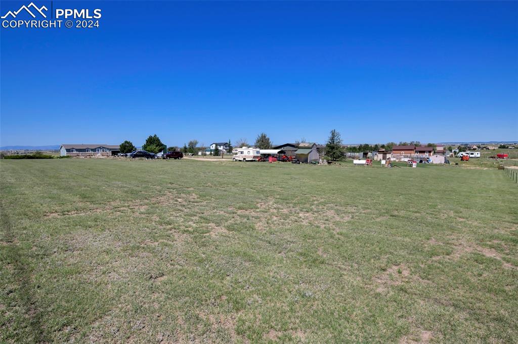 3975 Feather Ridge Drive Peyton, CO 80831 - Photo 12 of 36 a view of a field with an ocean