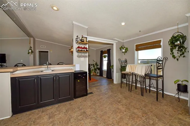 a bedroom with a bed rug and wooden floor
