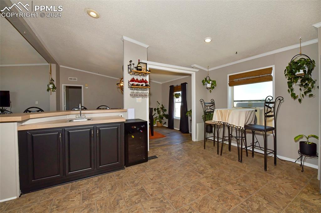 3975 Feather Ridge Drive Peyton, CO 80831 - Photo 24 of 36 a spacious bathroom with a sink and a mirror