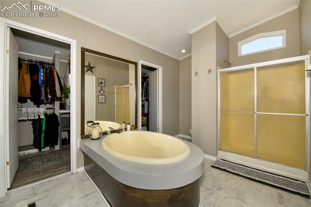 3975 Feather Ridge Drive Peyton, CO 80831 - Photo 28 of 36 a bathroom with a sink and a mirror