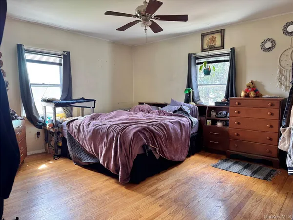 a bedroom with a bed and window