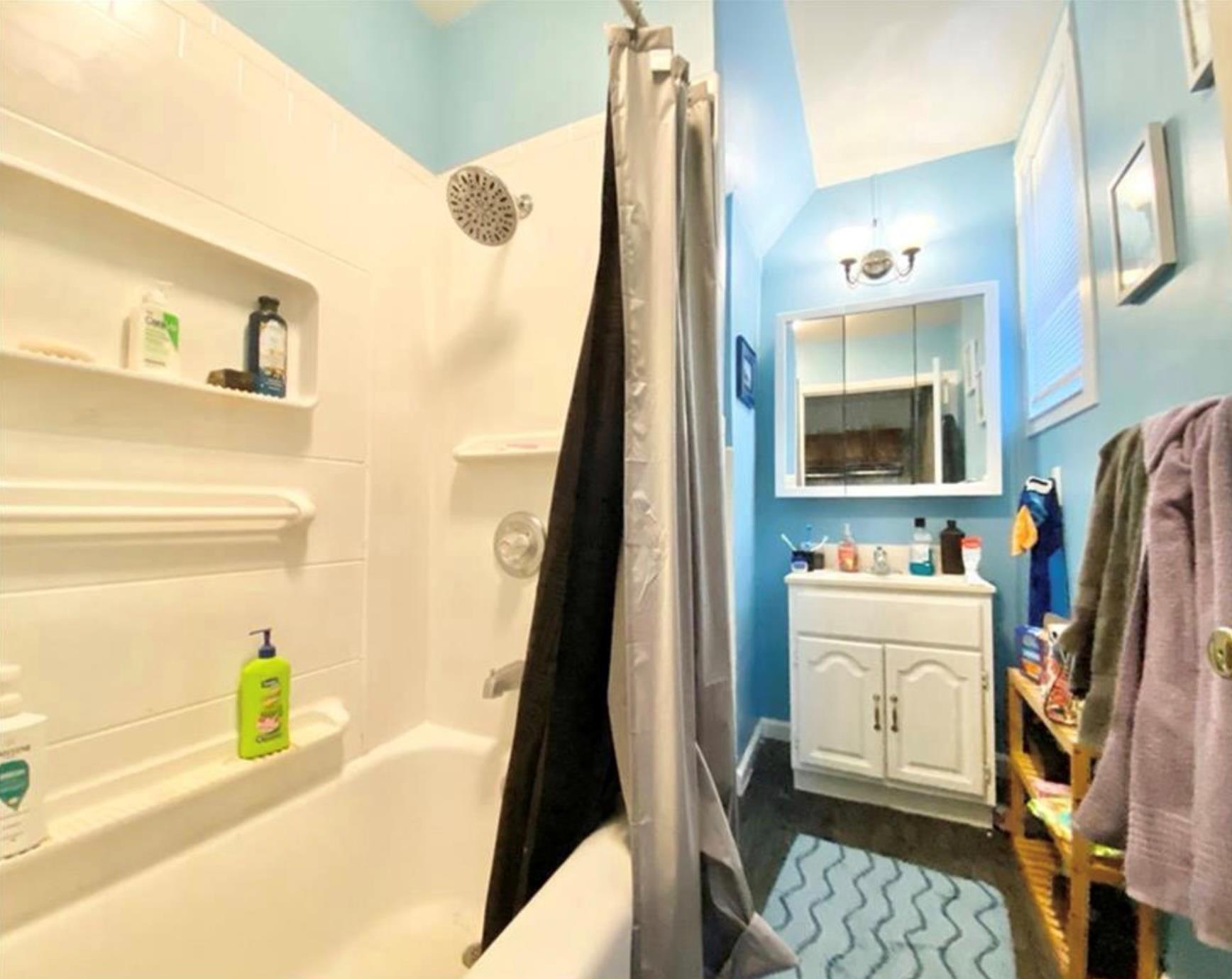 97 Deblock Road New Hampton, NY 10958 - Photo 16 of 28 a bathroom with a sink a mirror and a bathtub