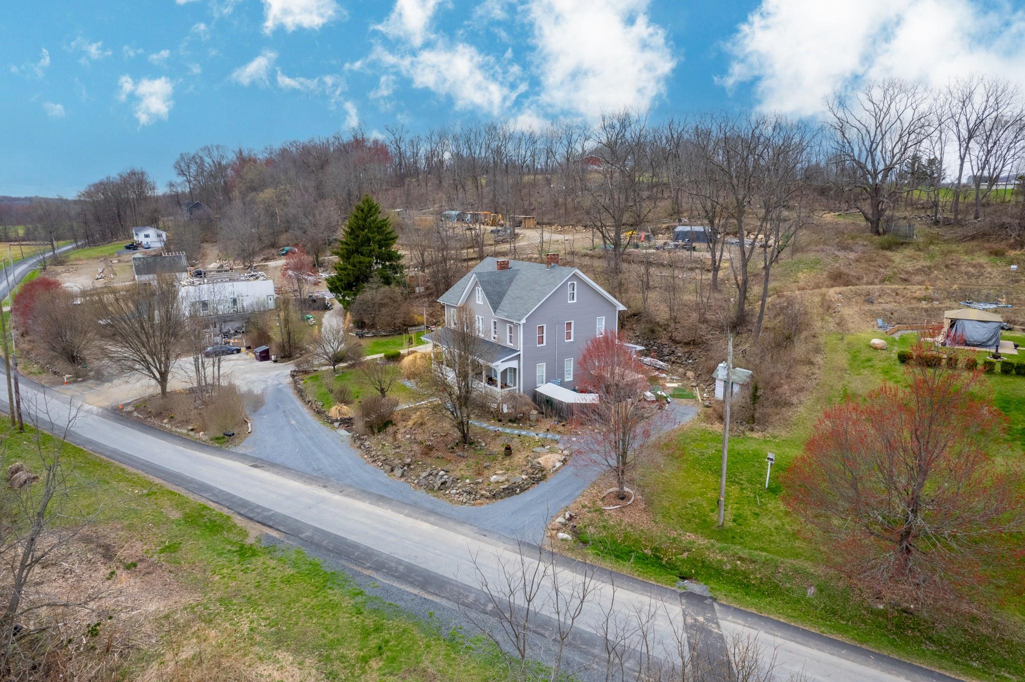 97 Deblock Road New Hampton, NY 10958 - Photo 3 of 28 a view of a lake with a house