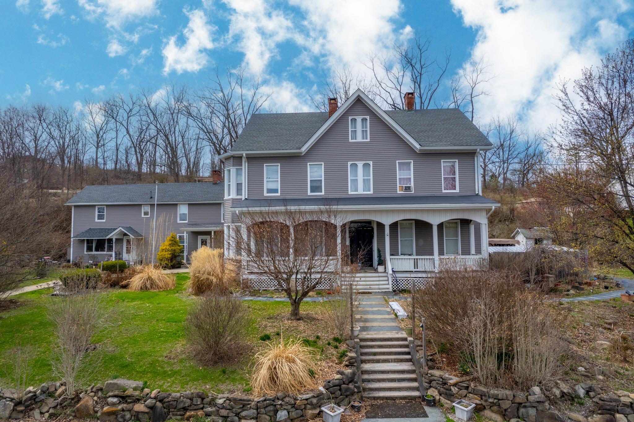 97 Deblock Road New Hampton, NY 10958 - Photo 4 of 28 a front view of a house with garden