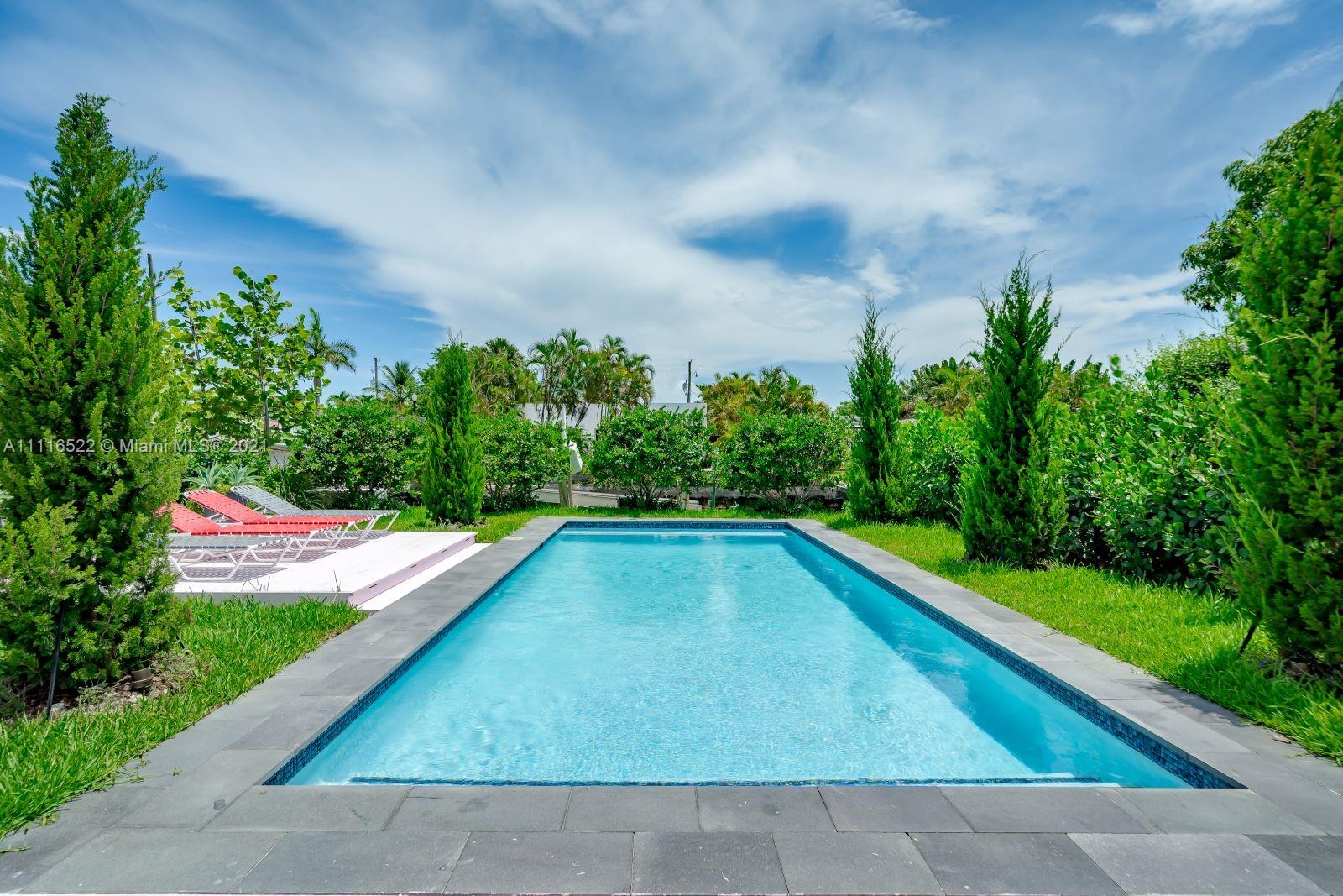 1600 Cleveland Road Miami Beach, FL 33141 - Photo 2 of 4 a view of swimming pool with a yard