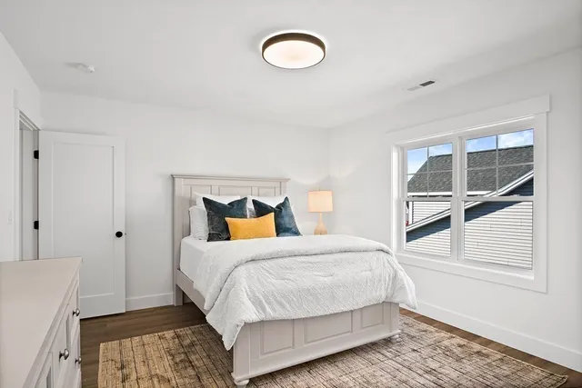 a bathroom with a sink mirror and toilet