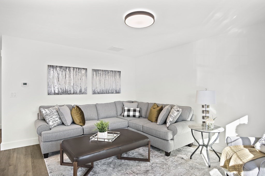 25 Salisbury Hill Boulevard, Unit 65 Worcester, MA 01609 - Photo 26 of 42 a living room with furniture and a couch