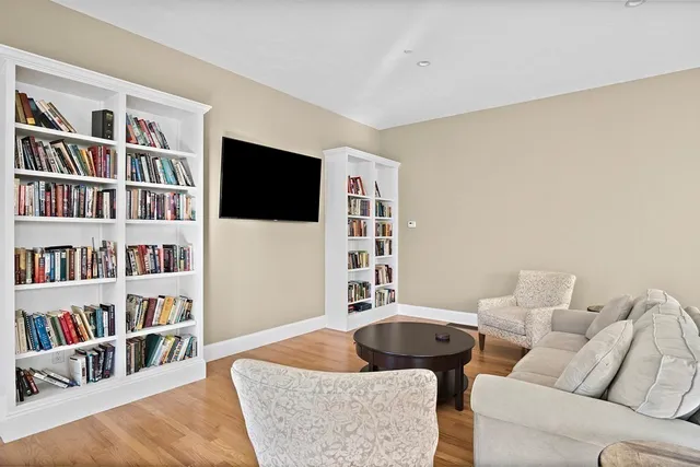 a living room with a fireplace and a window