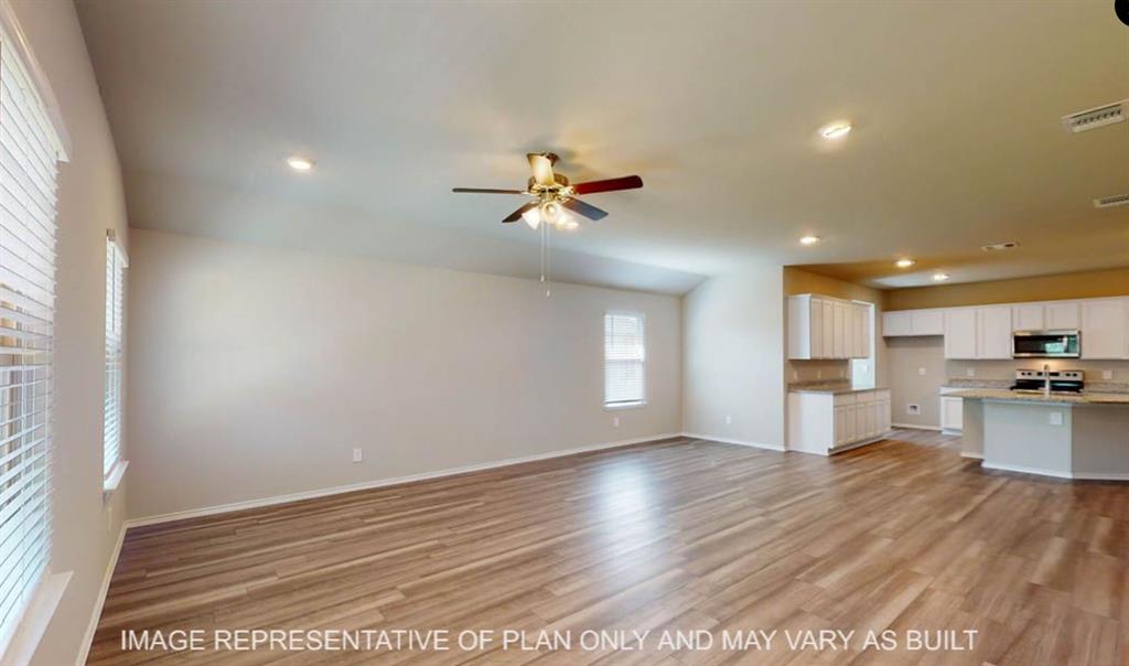 10204 Neptune Court Waco, TX 76708 - Photo 8 of 20 Spacious living area featuring wood-finish flooring, recessed lighting, and a ceiling fan