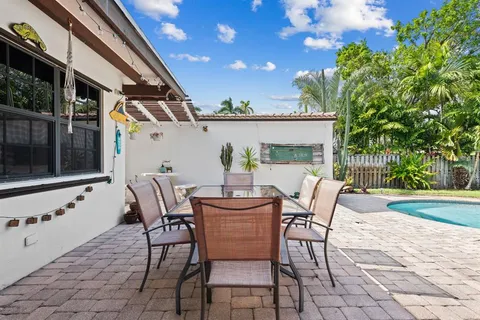 a view of an outdoor space with a table and chairs