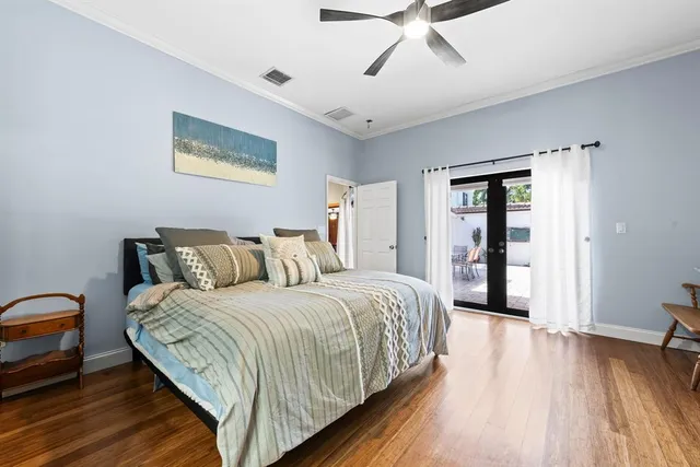 a spacious bedroom with a bed and a table