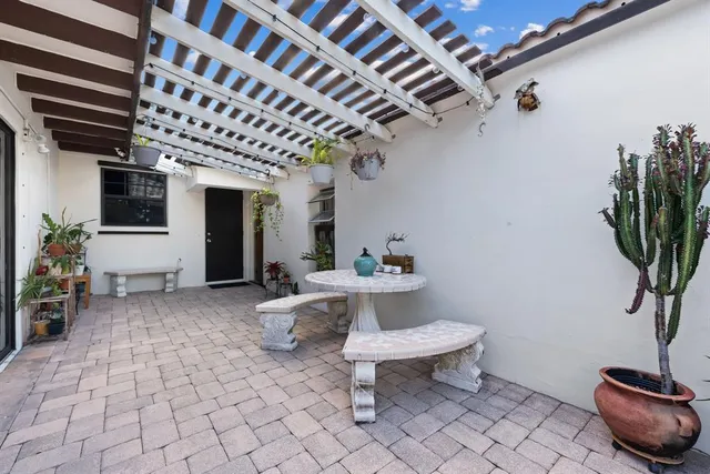 a view of a chairs and table in a patio