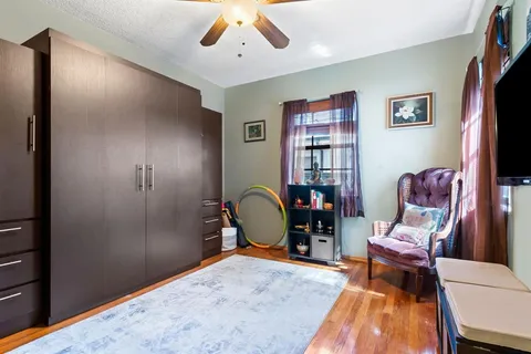 a view of a livingroom with furniture and a window