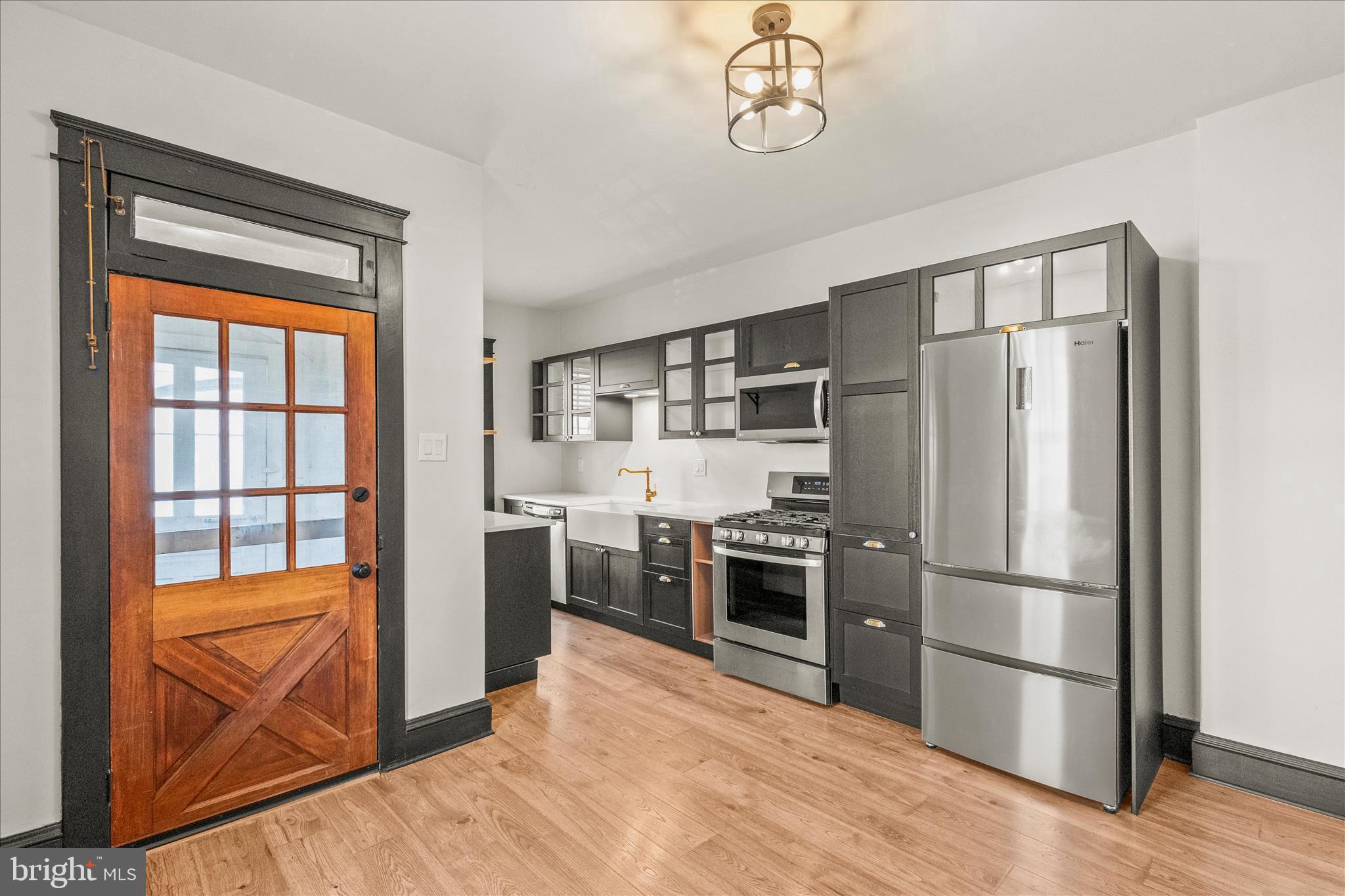 500 South Franklin Street Hanover, PA 17331 - Photo 12 of 36 a kitchen with stainless steel appliances granite countertop a refrigerator and a stove top oven