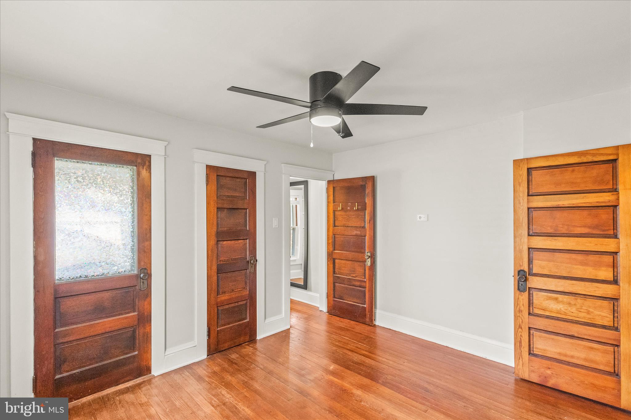 500 South Franklin Street Hanover, PA 17331 - Photo 16 of 36 a view of an empty room with wooden floor and a ceiling fan
